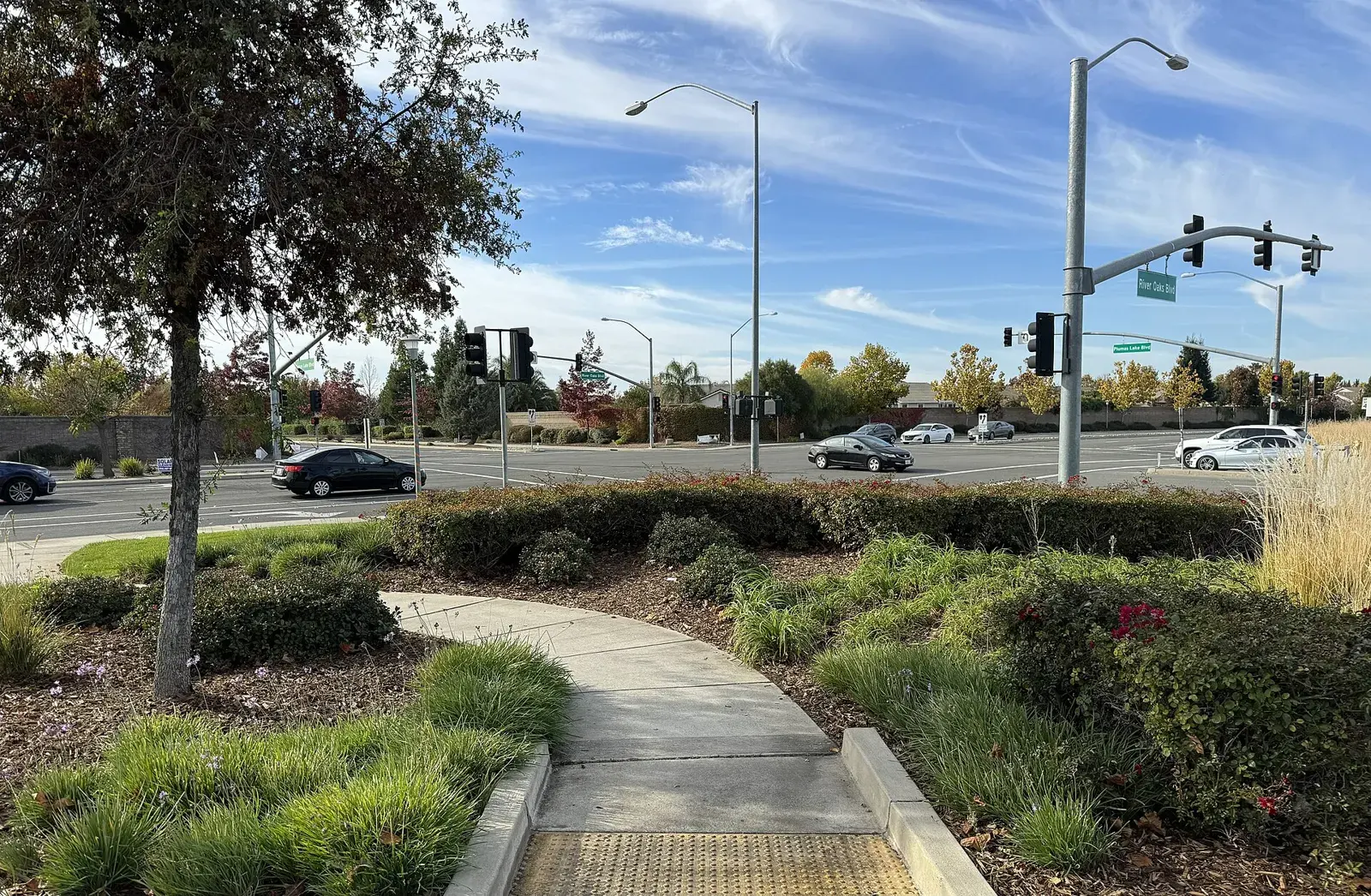 Landscaped corner where Plumas Lake Boulevard meets River Oaks Boulevard in Plumas Lake, California